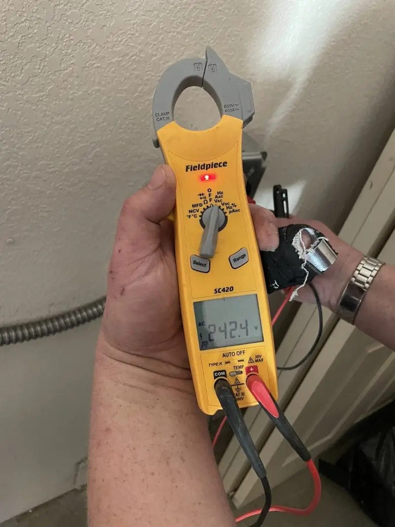 Voltage testing with clamp meter during Generator Installation in Madison Heights